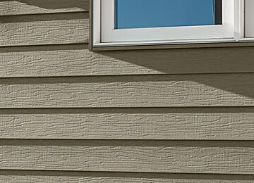 Klauer’s Steel Siding in a close-up of a home with square windows